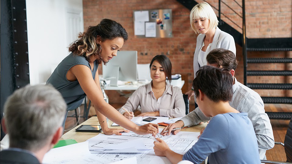 Group of social workers analyzing a hazard mitigation project